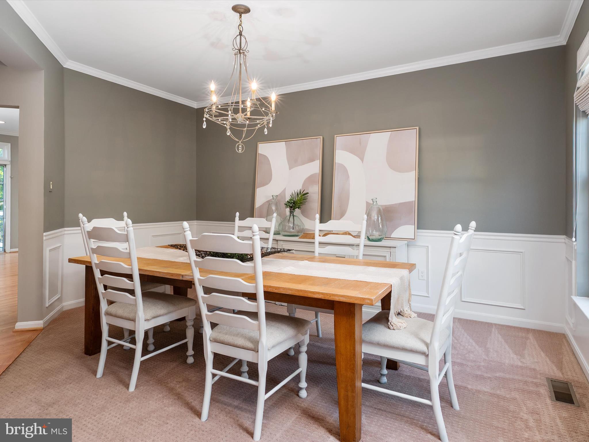 6209 Gatepost Way Elkridge, MD 21075 - Photo 13 of 74 a dining room with a wooden table and chairs