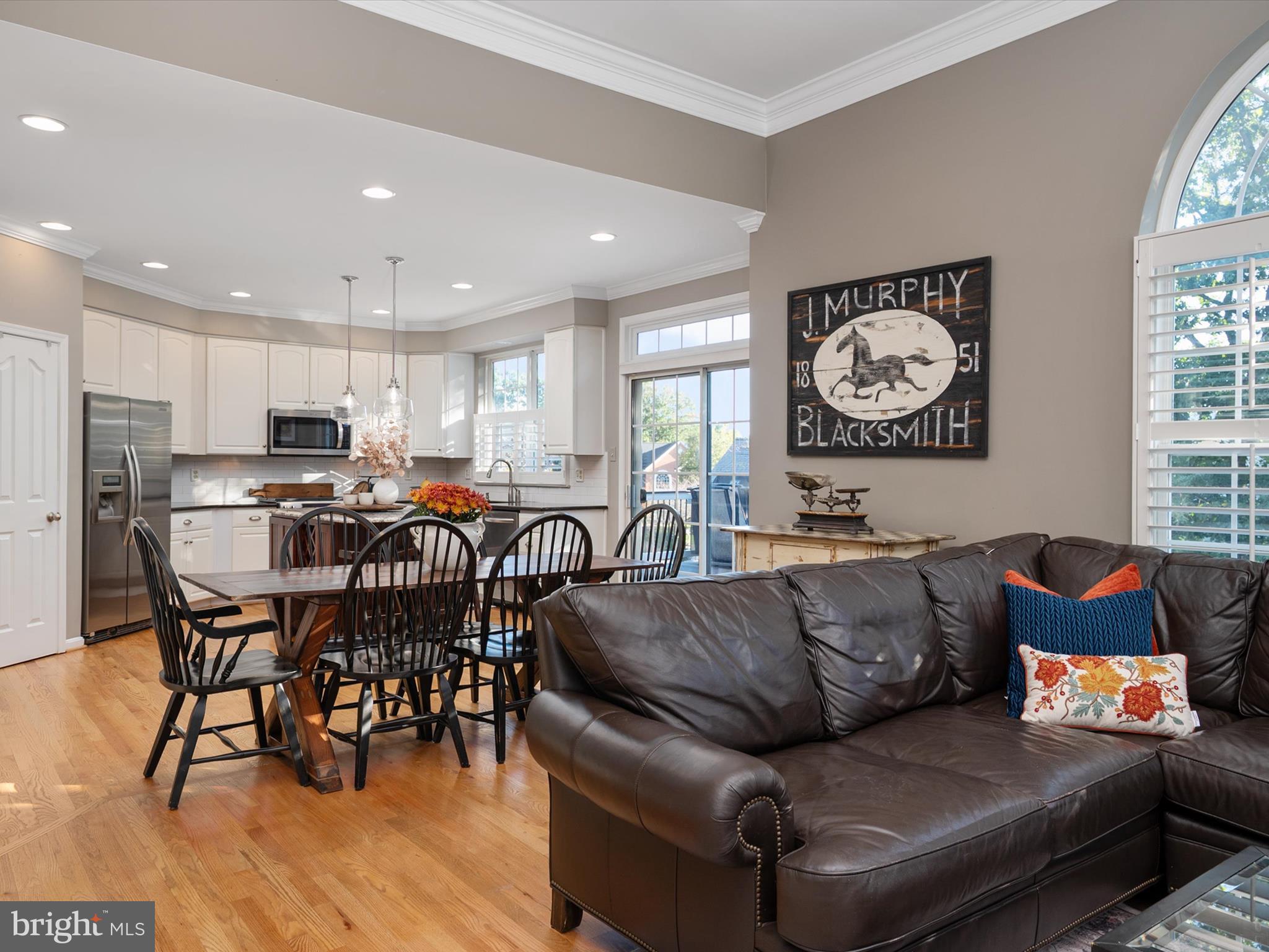 6209 Gatepost Way Elkridge, MD 21075 - Photo 20 of 74 a living room with furniture and kitchen view