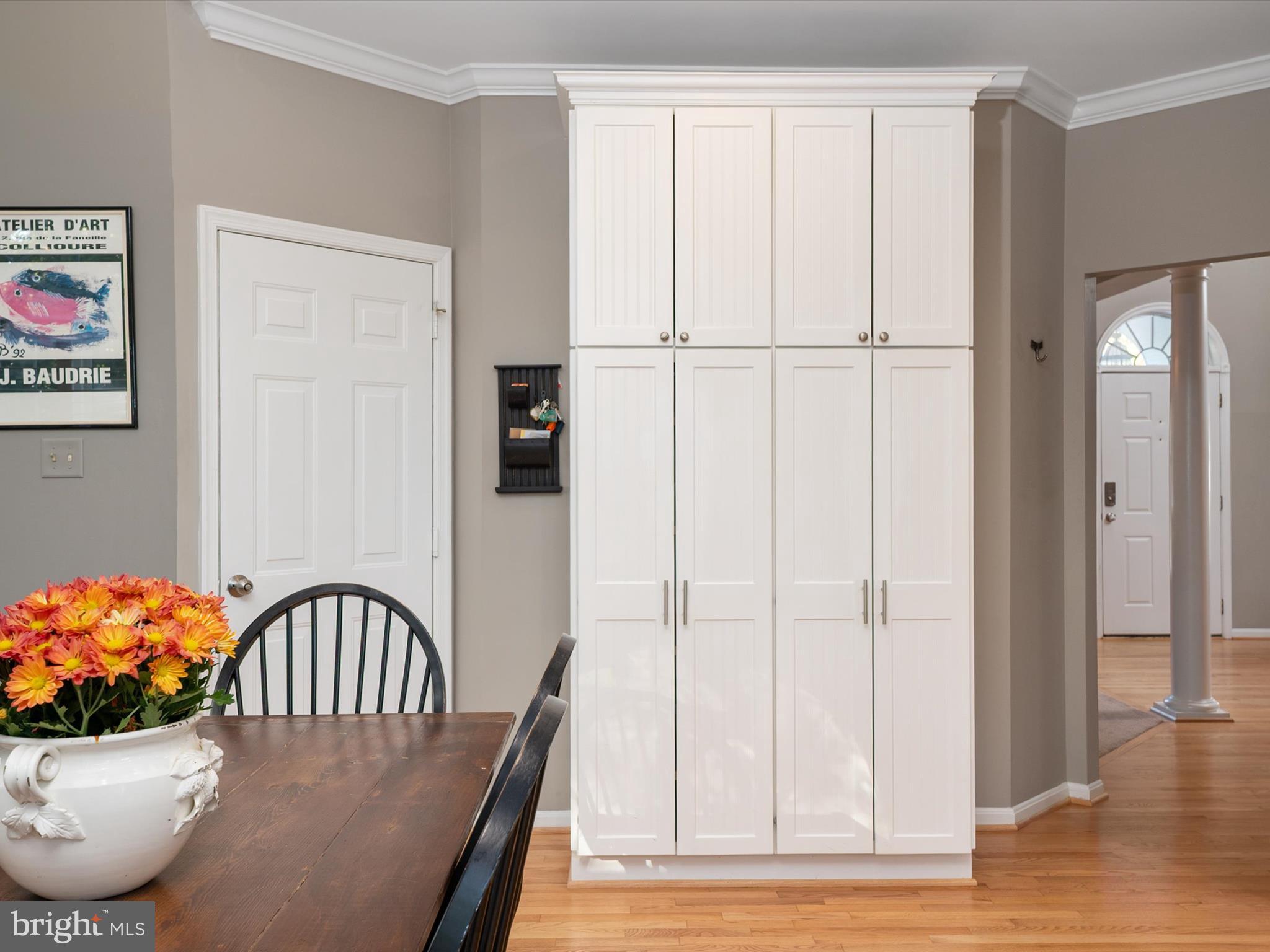 6209 Gatepost Way Elkridge, MD 21075 - Photo 24 of 74 a view of a dining room with furniture and wooden floor