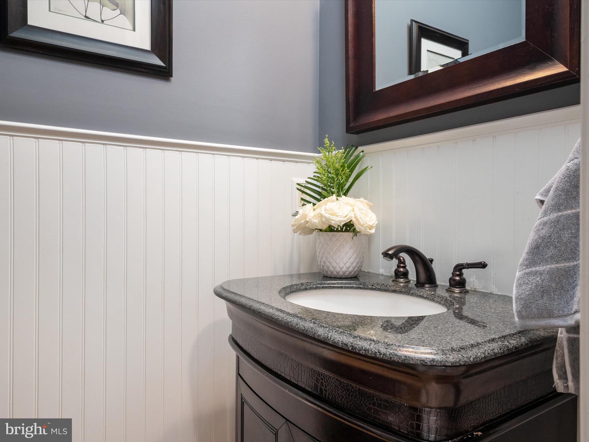 6209 Gatepost Way Elkridge, MD 21075 - Photo 28 of 74 a bathroom with a granite countertop sink and a mirror