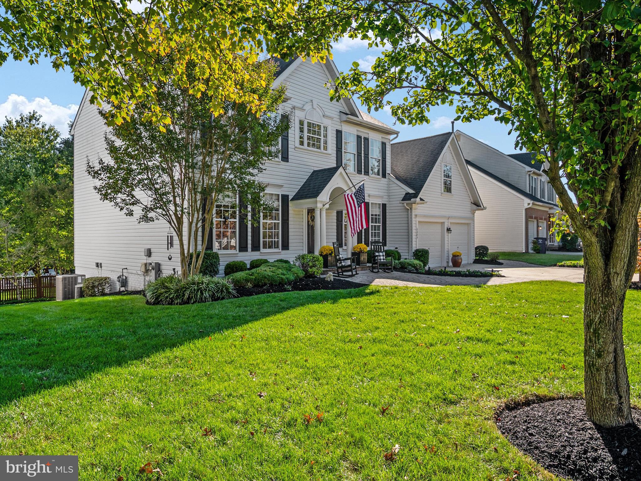 6209 Gatepost Way Elkridge, MD 21075 - Photo 3 of 74 a front view of a house with garden