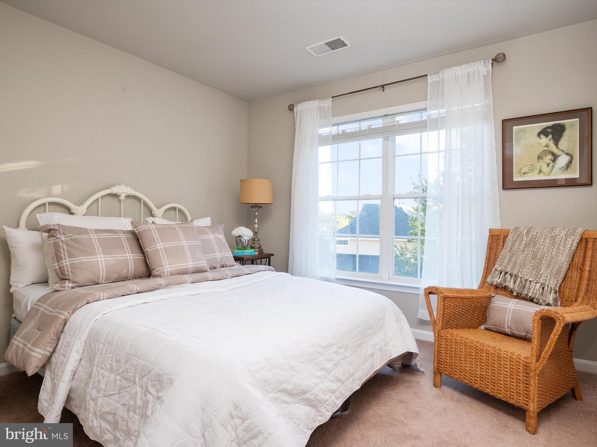 6209 Gatepost Way Elkridge, MD 21075 - Photo 33 of 74 a bedroom with a bed and a couch