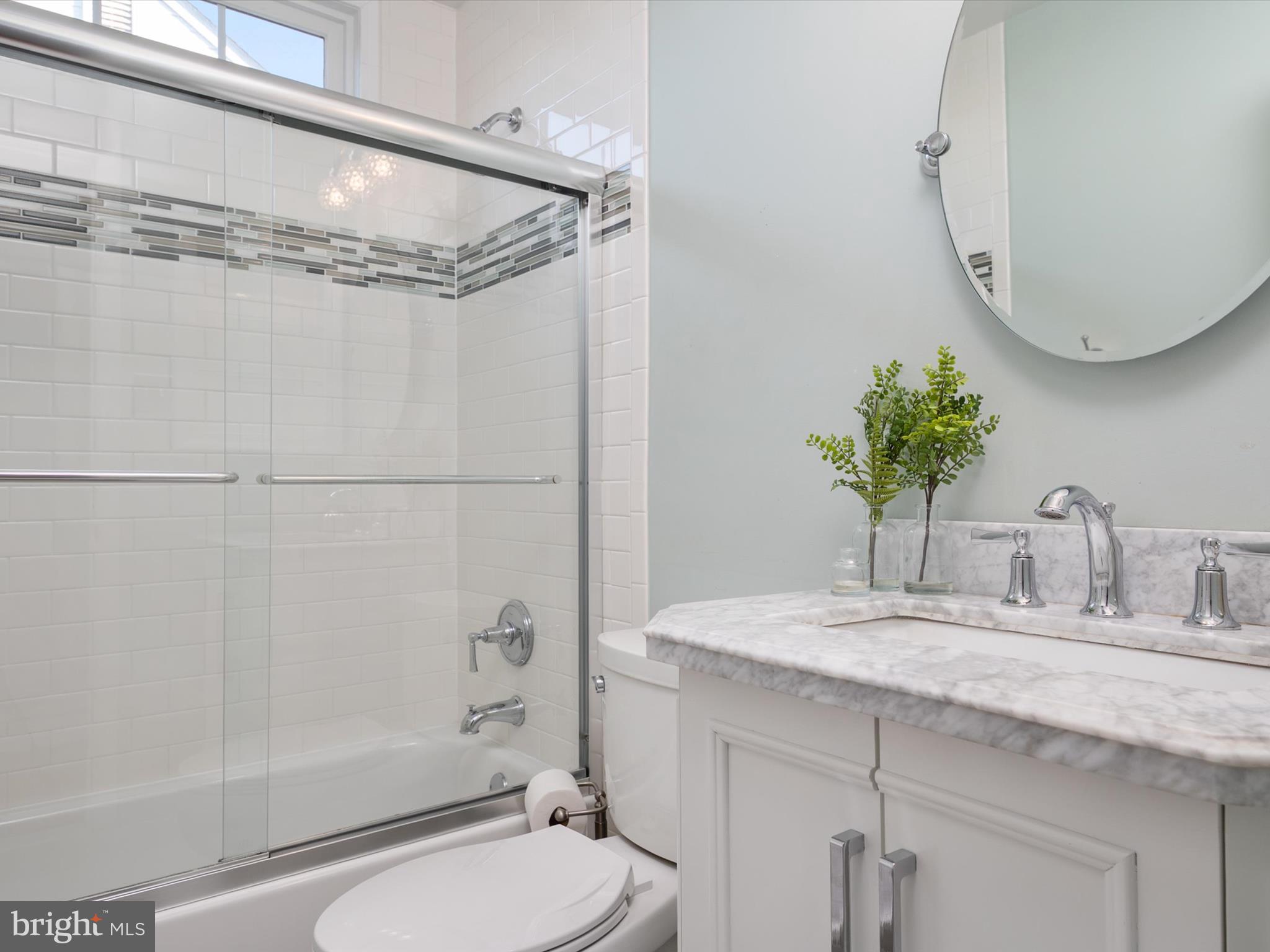 6209 Gatepost Way Elkridge, MD 21075 - Photo 35 of 74 a bathroom with a granite countertop sink a toilet and shower