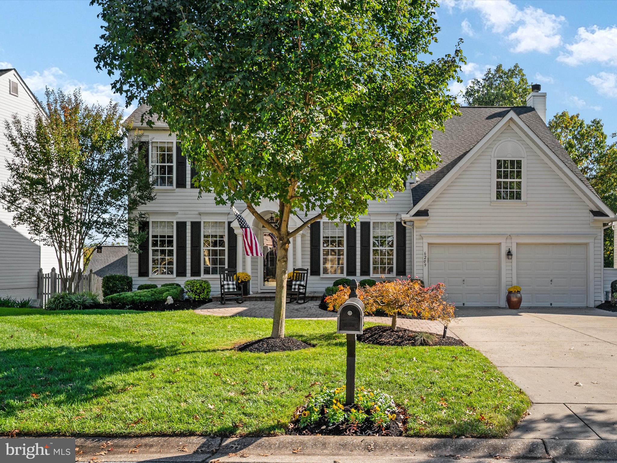 6209 Gatepost Way Elkridge, MD 21075 - Photo 4 of 74 a front view of a house with garden