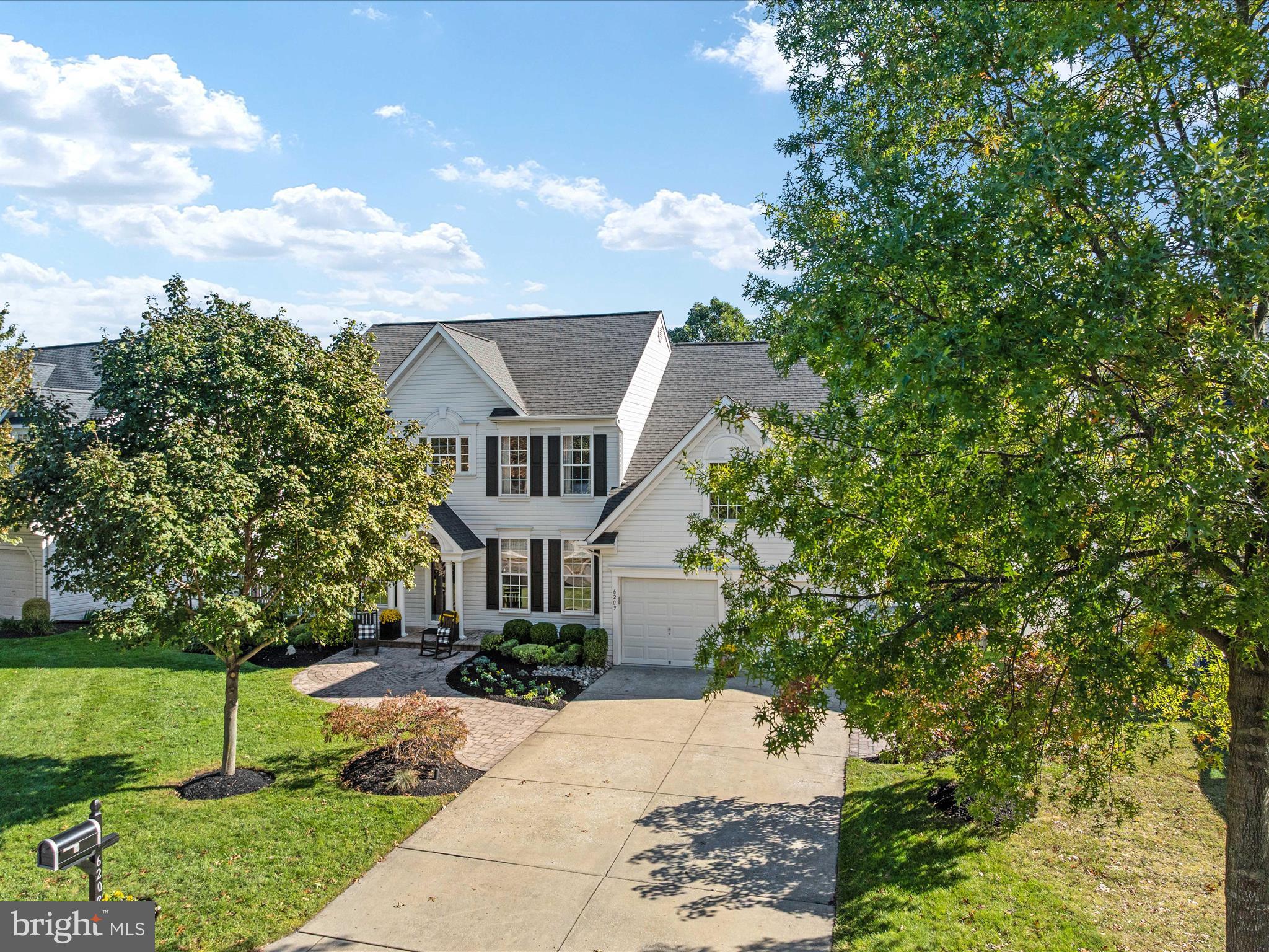 6209 Gatepost Way Elkridge, MD 21075 - Photo 5 of 74 a front view of a house with a yard