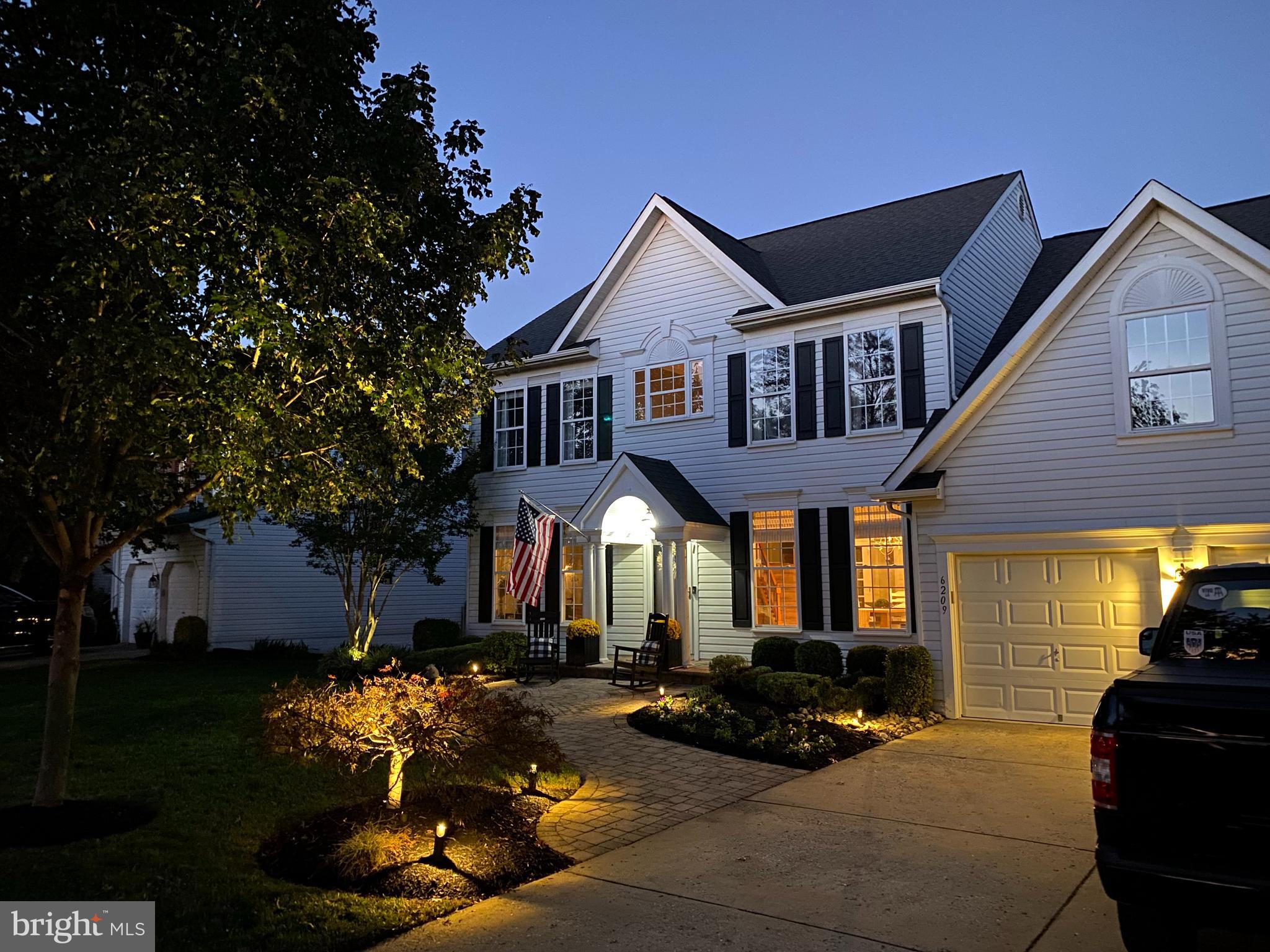 6209 Gatepost Way Elkridge, MD 21075 - Photo 65 of 74 a front view of a house with a yard