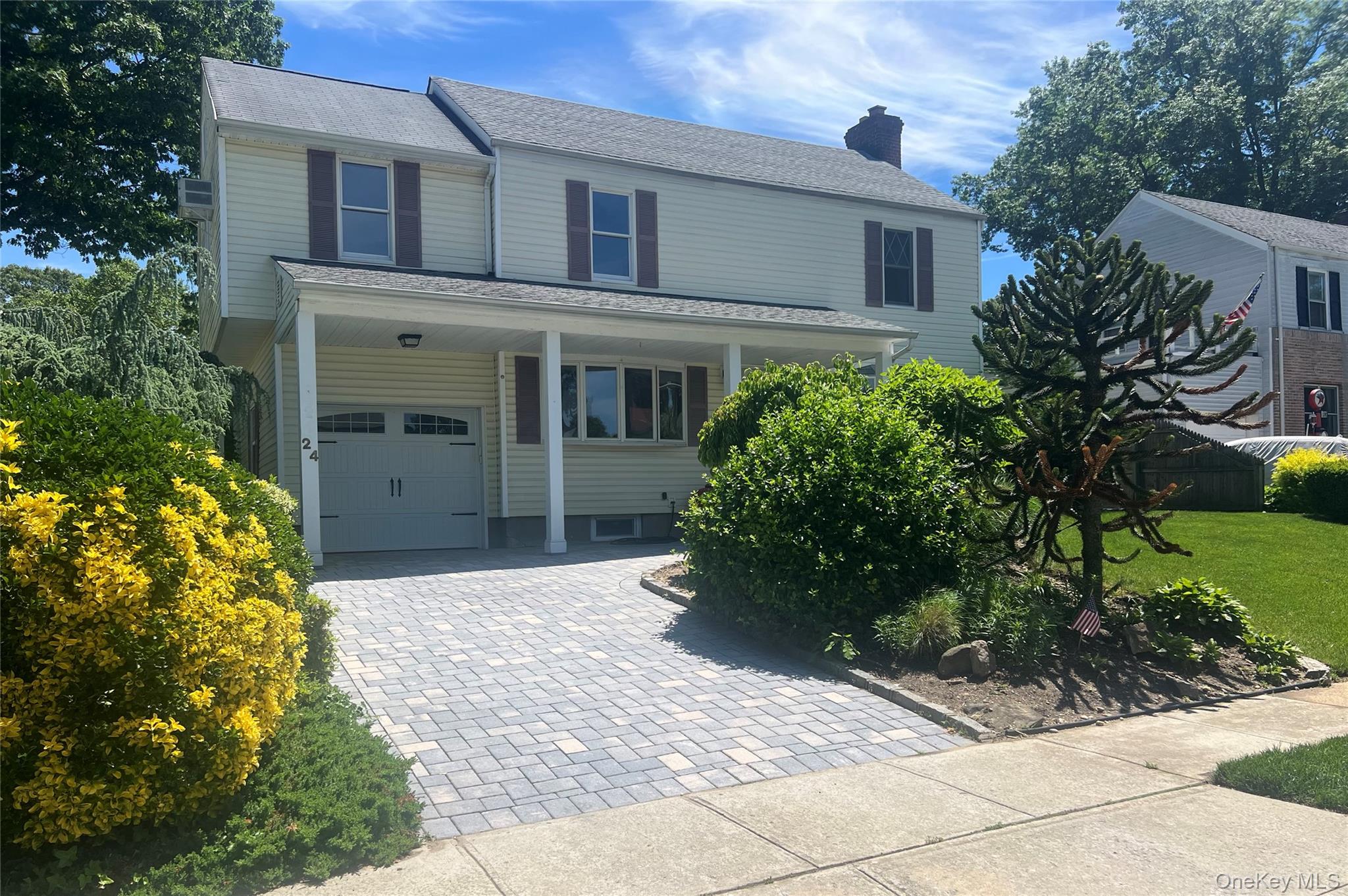 24 Purdue Road Glen Cove, NY 11542 - Photo 33 of 41 a front view of a house with a yard