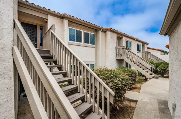a view of a house with wooden stairs
