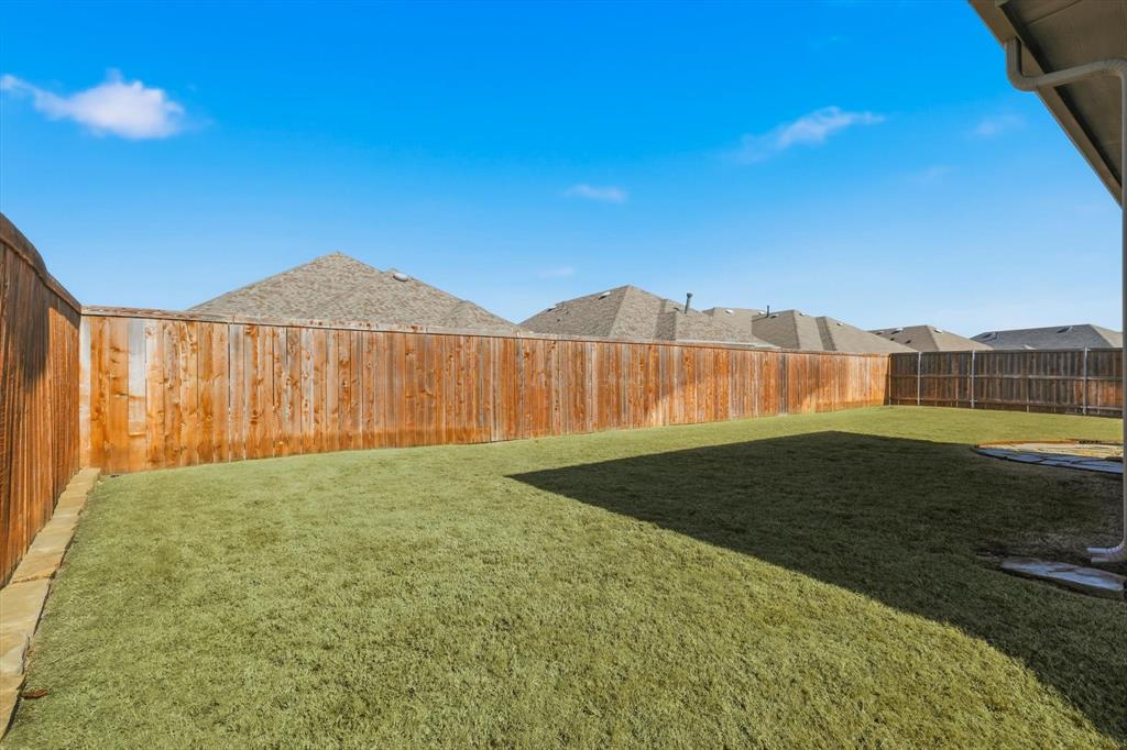 1701 Shetland Road Aubrey, TX 76227 - Photo 20 of 31 a view of a backyard