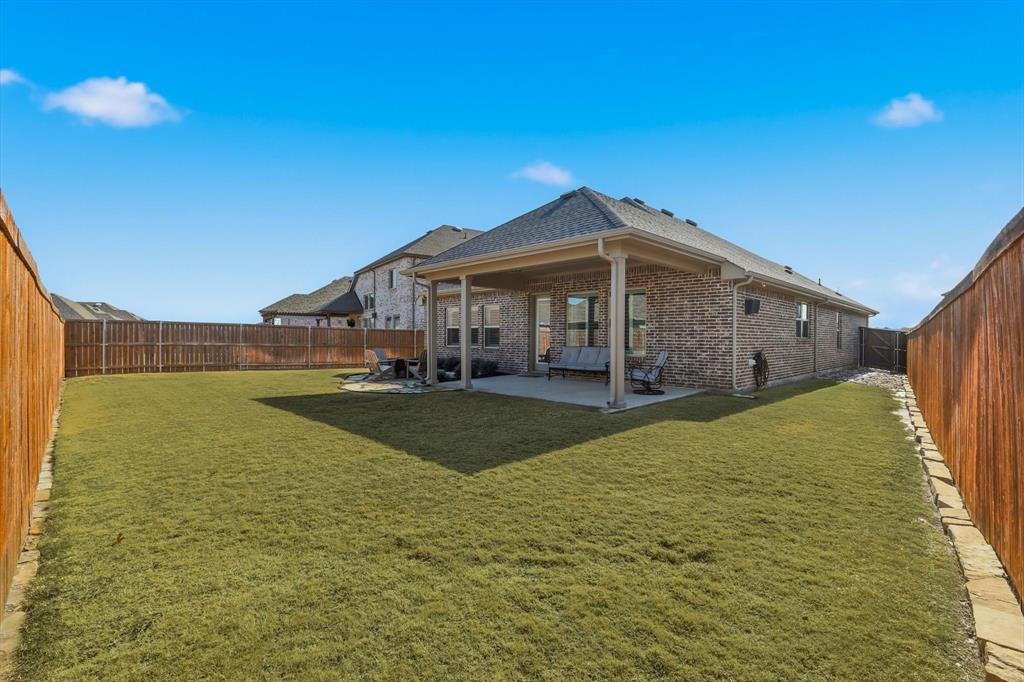 1701 Shetland Road Aubrey, TX 76227 - Photo 21 of 31 a view of a house with a swimming pool