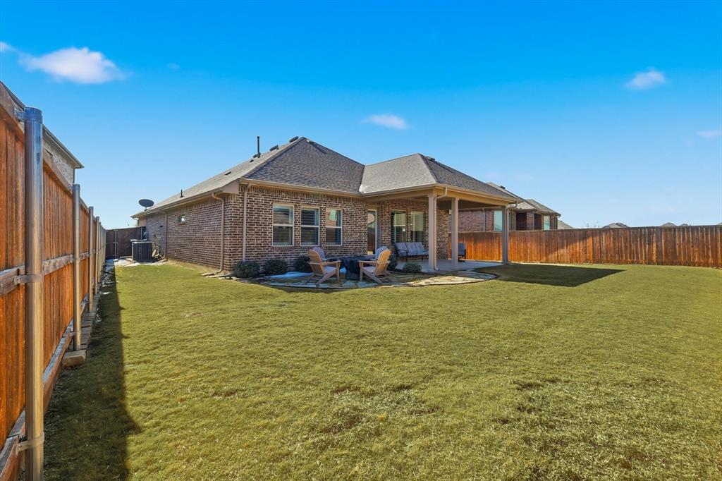 1701 Shetland Road Aubrey, TX 76227 - Photo 22 of 31 a front view of a house with a garden