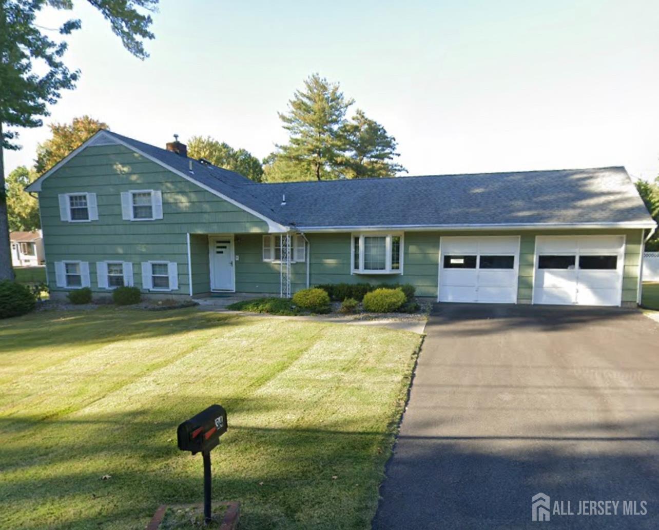 34 Nottingham Road Edison, NJ 08820 - Photo 1 of 1 a front view of a house with a yard