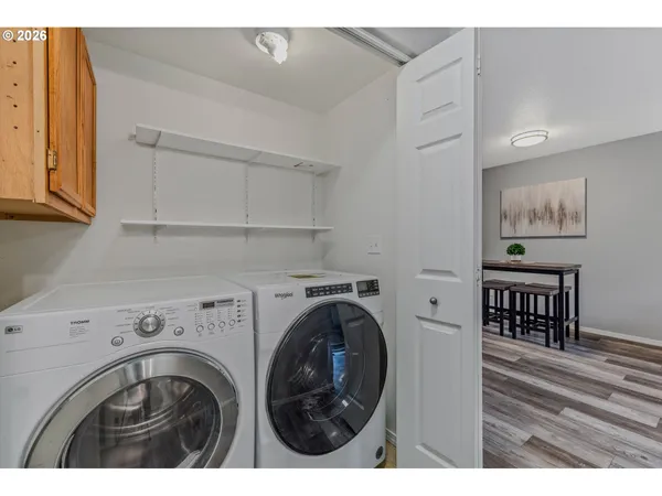 a view of livingroom with washer and dryer