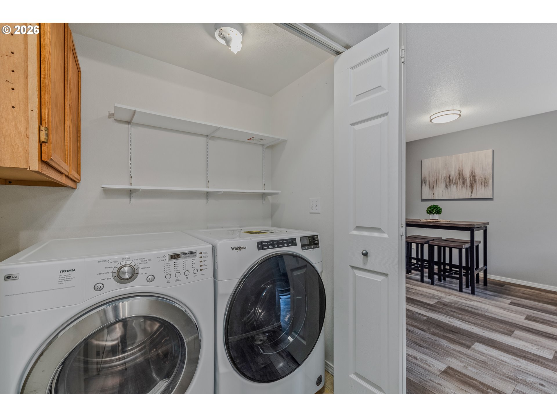 19159 Southeast Yamhill Street, Unit 15 Portland, OR 97233 - Photo 11 of 23 a view of livingroom with washer and dryer