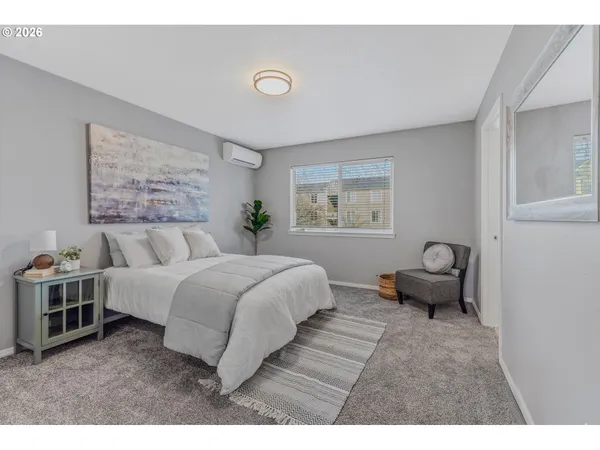 a bedroom with a bed and a couch