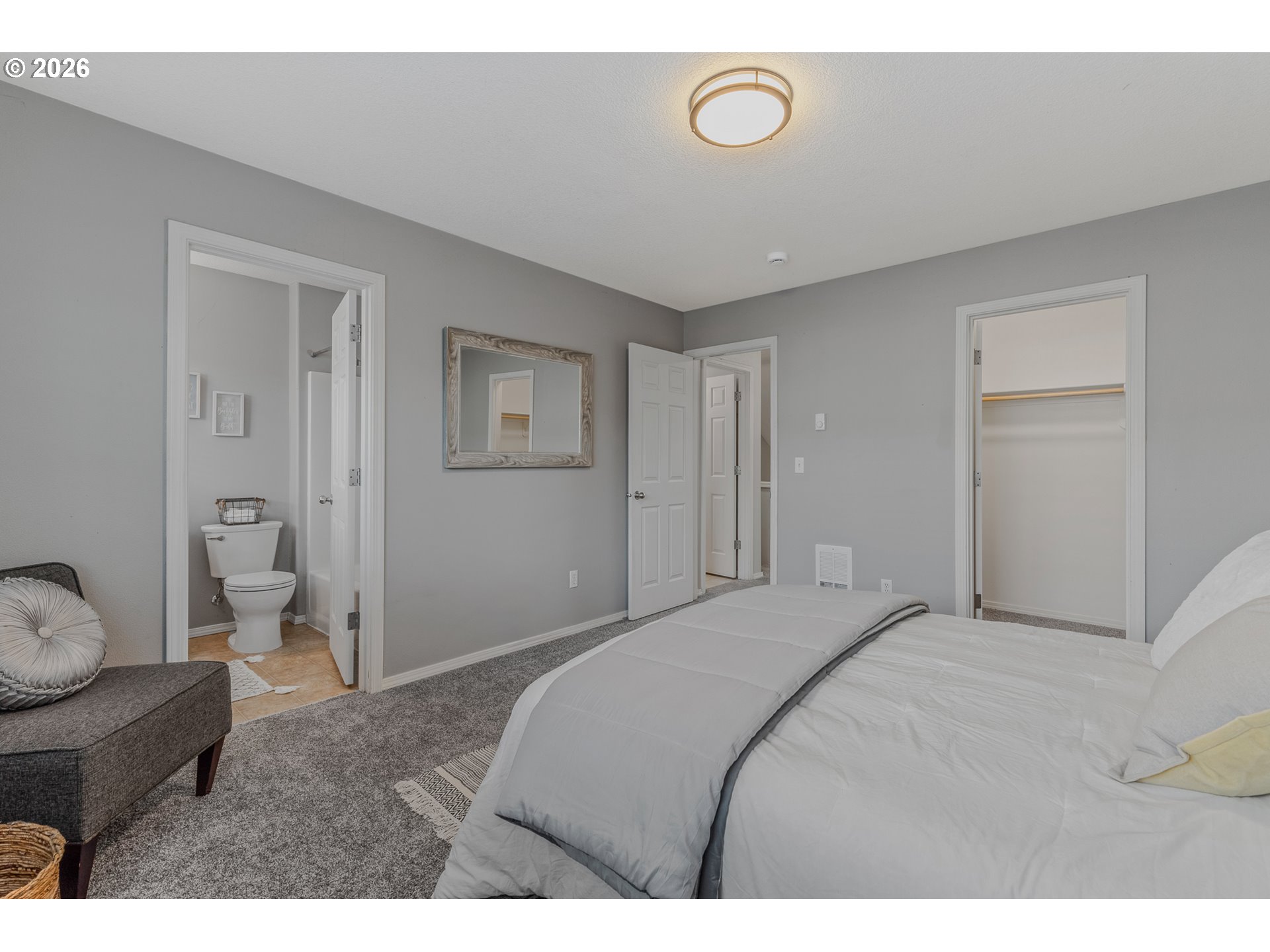 19159 Southeast Yamhill Street, Unit 15 Portland, OR 97233 - Photo 14 of 23 a bedroom with a bed and a couch