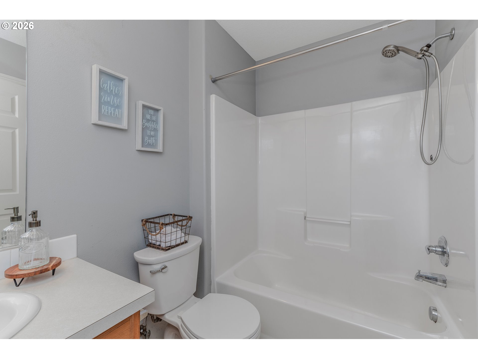 19159 Southeast Yamhill Street, Unit 15 Portland, OR 97233 - Photo 16 of 23 a bathroom with a sink toilet and shower