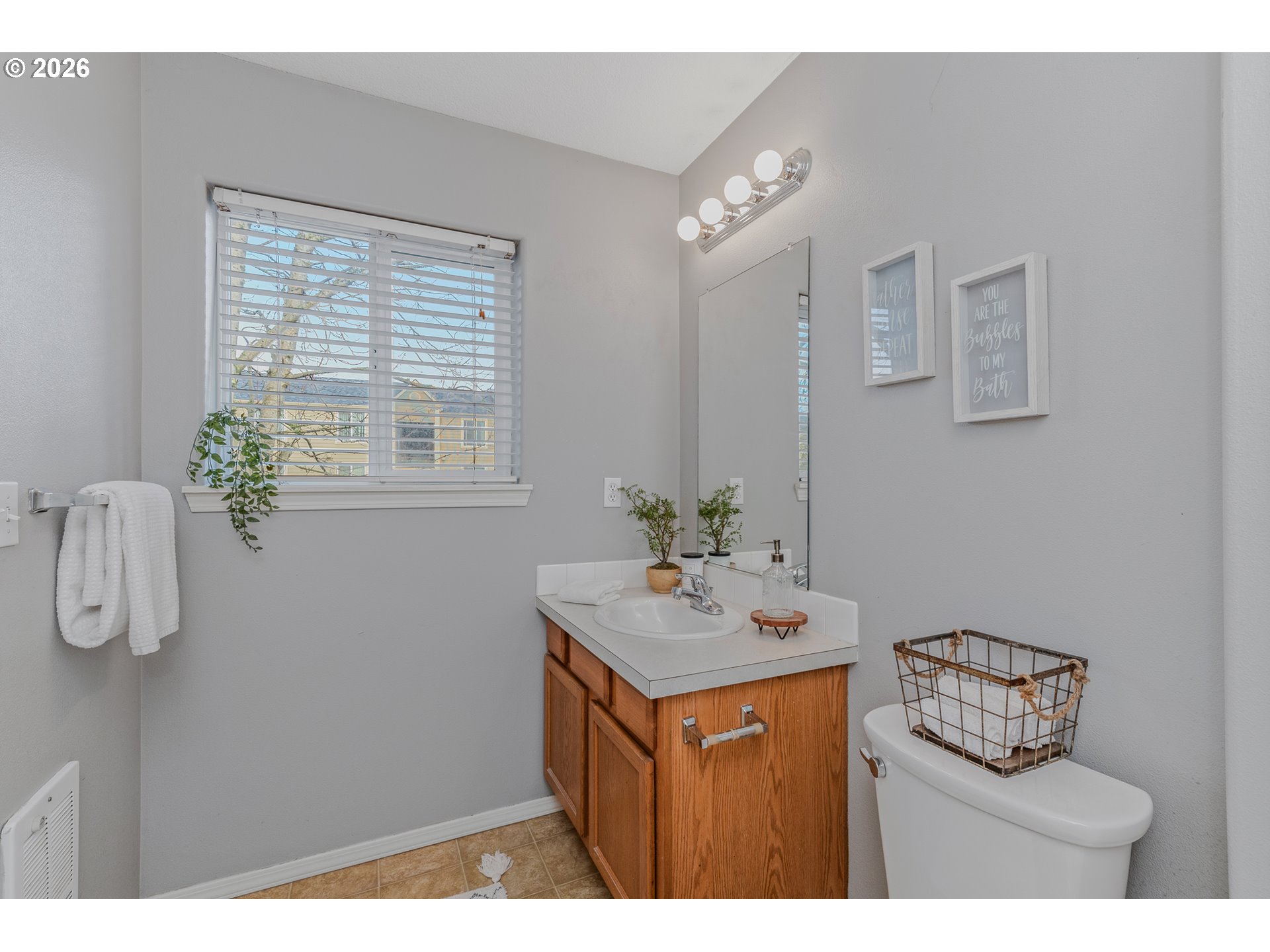 19159 Southeast Yamhill Street, Unit 15 Portland, OR 97233 - Photo 17 of 23 a bathroom with a sink vanity and mirror