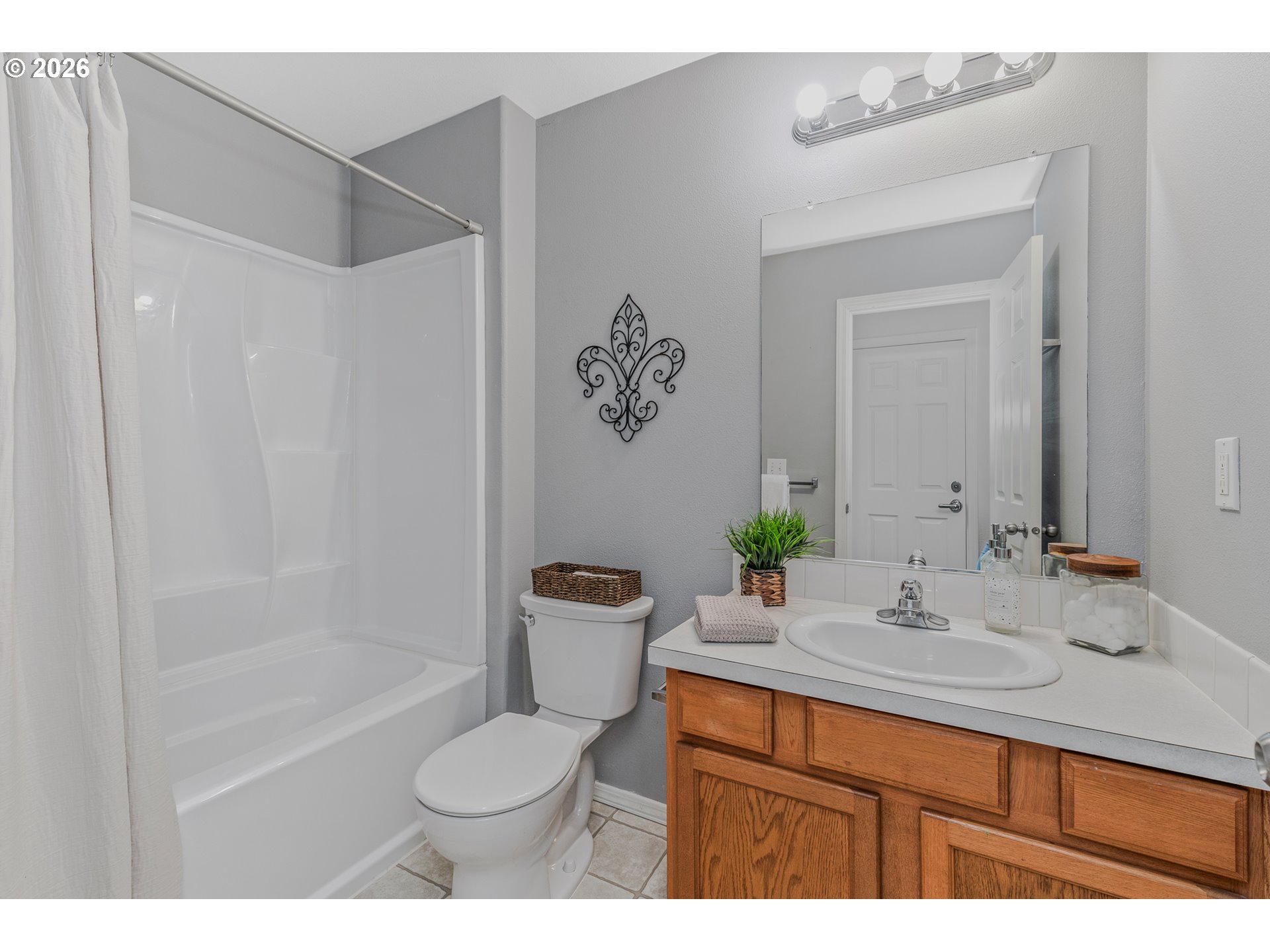 19159 Southeast Yamhill Street, Unit 15 Portland, OR 97233 - Photo 21 of 23 a bathroom with a sink toilet and shower