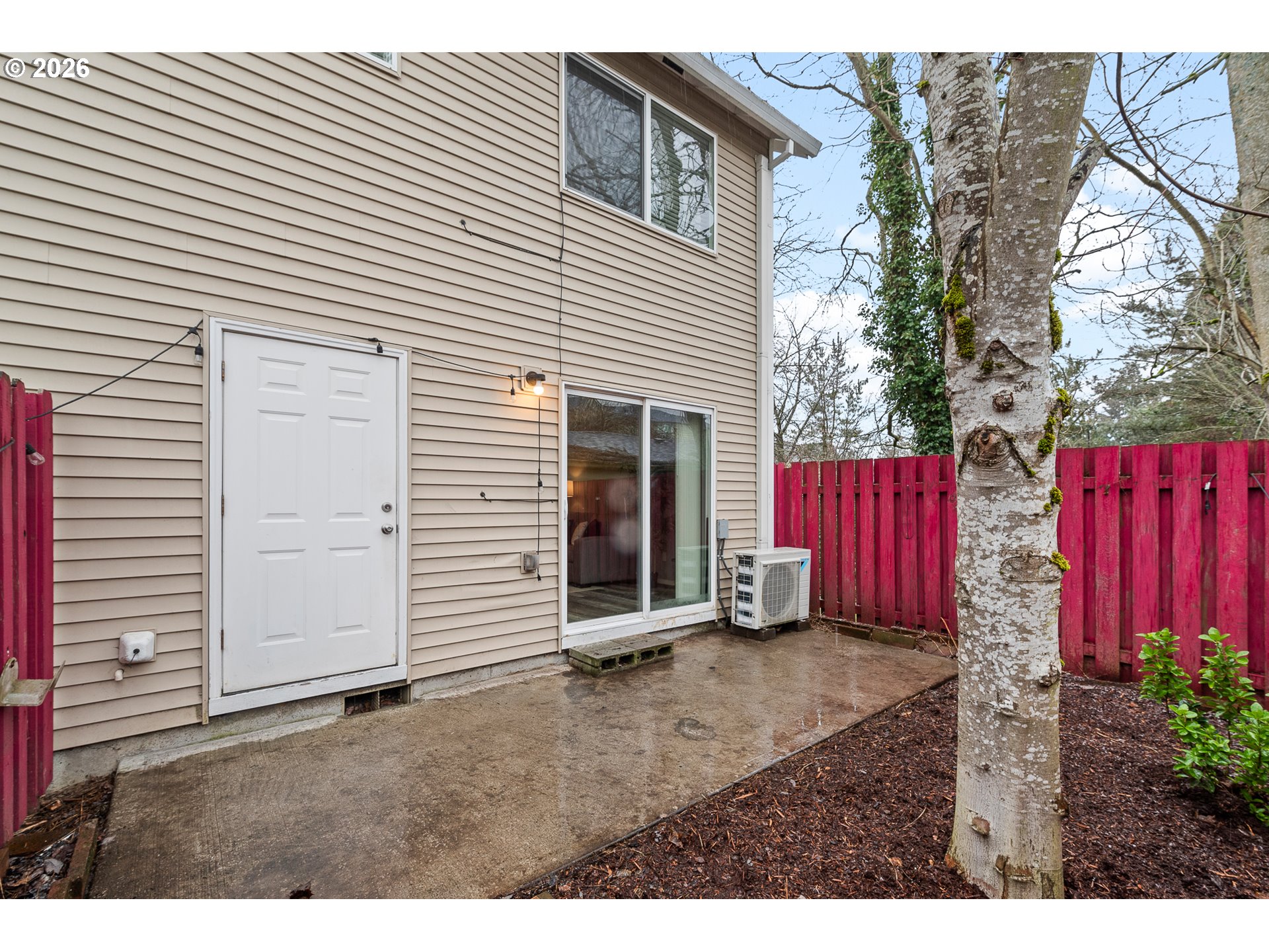 19159 Southeast Yamhill Street, Unit 15 Portland, OR 97233 - Photo 23 of 23 a view of a house with backyard and wooden fence