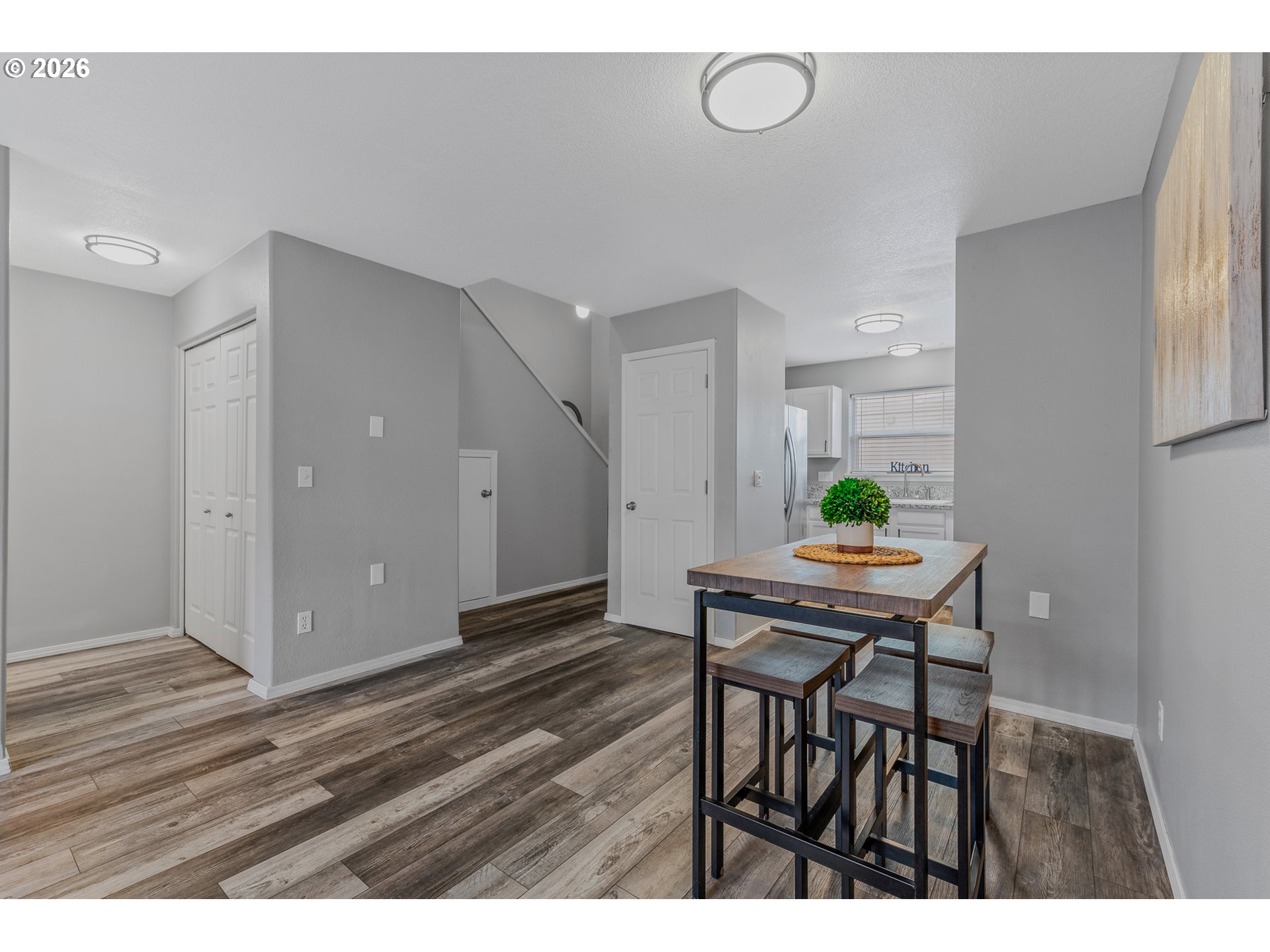 19159 Southeast Yamhill Street, Unit 15 Portland, OR 97233 - Photo 6 of 23 a view of a dining room with furniture and wooden floor