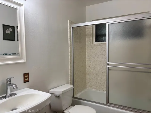 a bathroom with a toilet and a sink