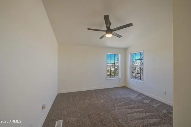 a room with a refrigerator and a window