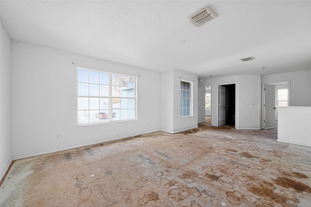 512 Flower Fields Lane Orlando, FL 32824 - Photo 23 of 28 a view of an empty room with a window