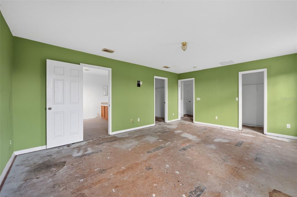 512 Flower Fields Lane Orlando, FL 32824 - Photo 10 of 28 a view of an empty room with closet and a fireplace