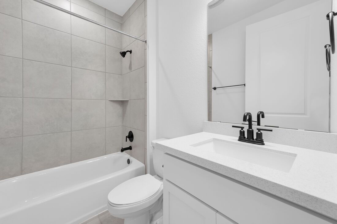 113 Wingstem Way Georgetown, TX 78633 - Photo 14 of 37 a bathroom with a sink a toilet and shower