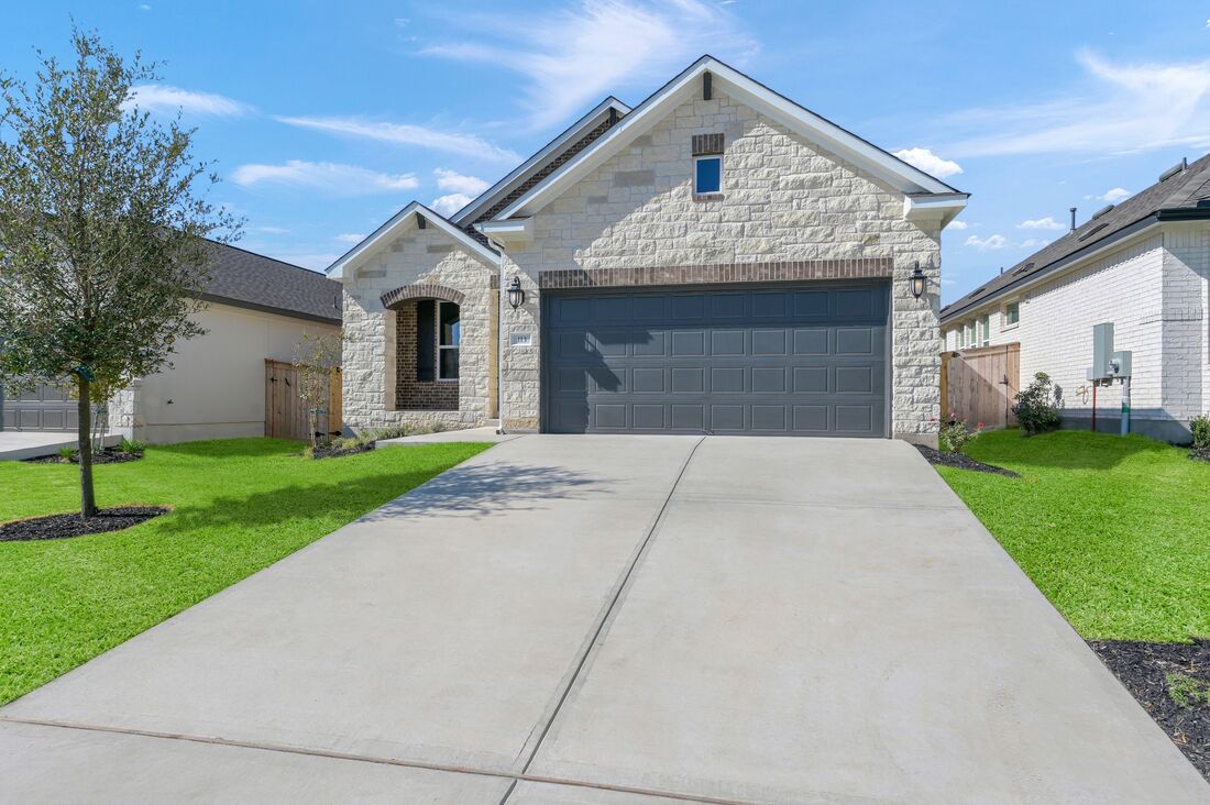 113 Wingstem Way Georgetown, TX 78633 - Photo 18 of 37 a front view of a house with a yard and garage