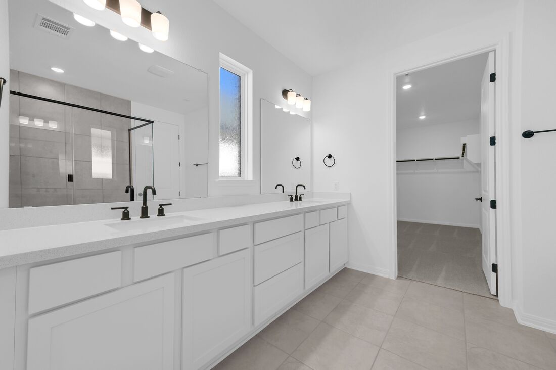 113 Wingstem Way Georgetown, TX 78633 - Photo 10 of 37 a spacious bathroom with double sink and a mirror