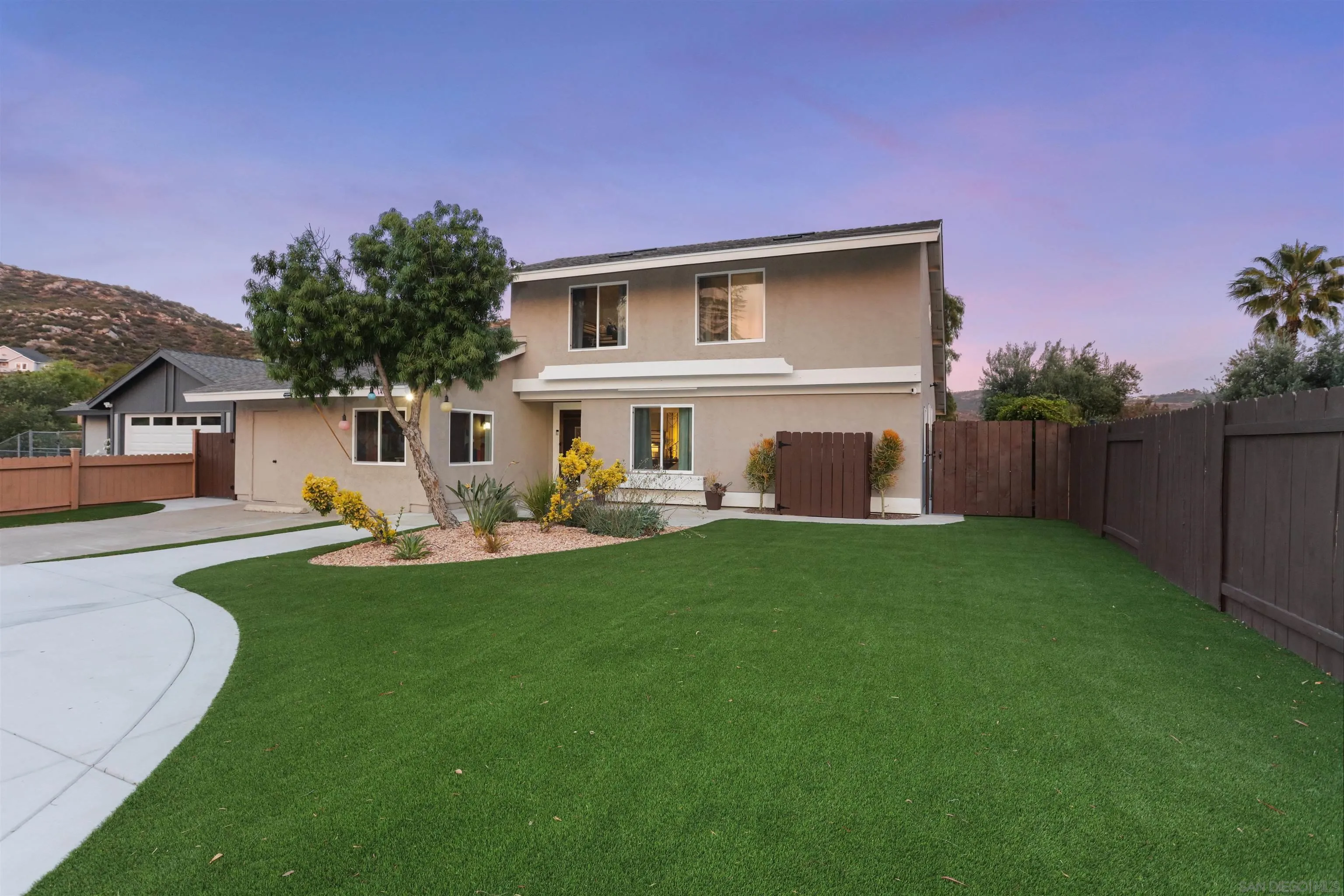 a front view of house with yard and outdoor seating