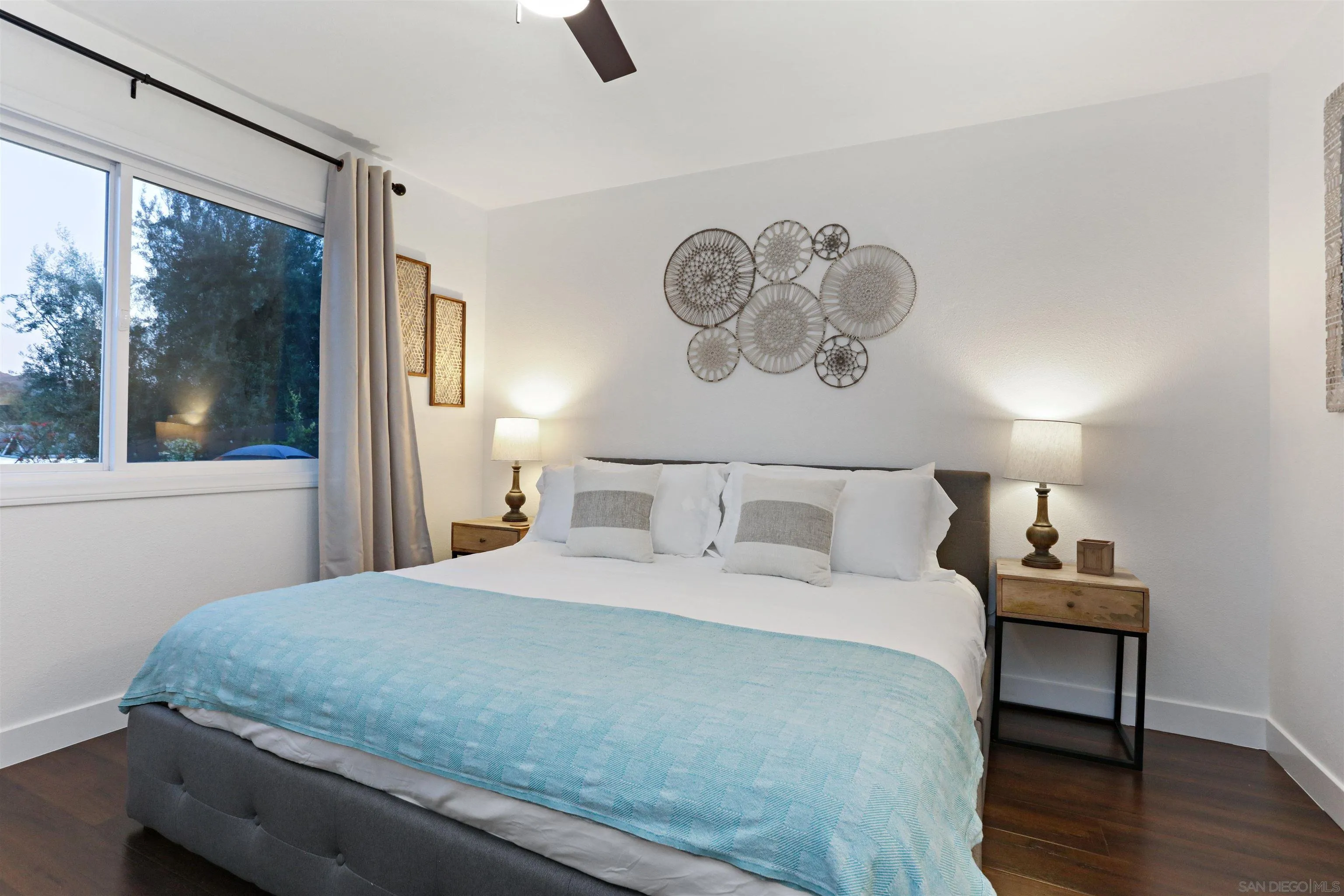 14607 Bowdoin Road Poway, CA 92064 - Photo 16 of 30 a bedroom with a bed and a large mirror next to a window