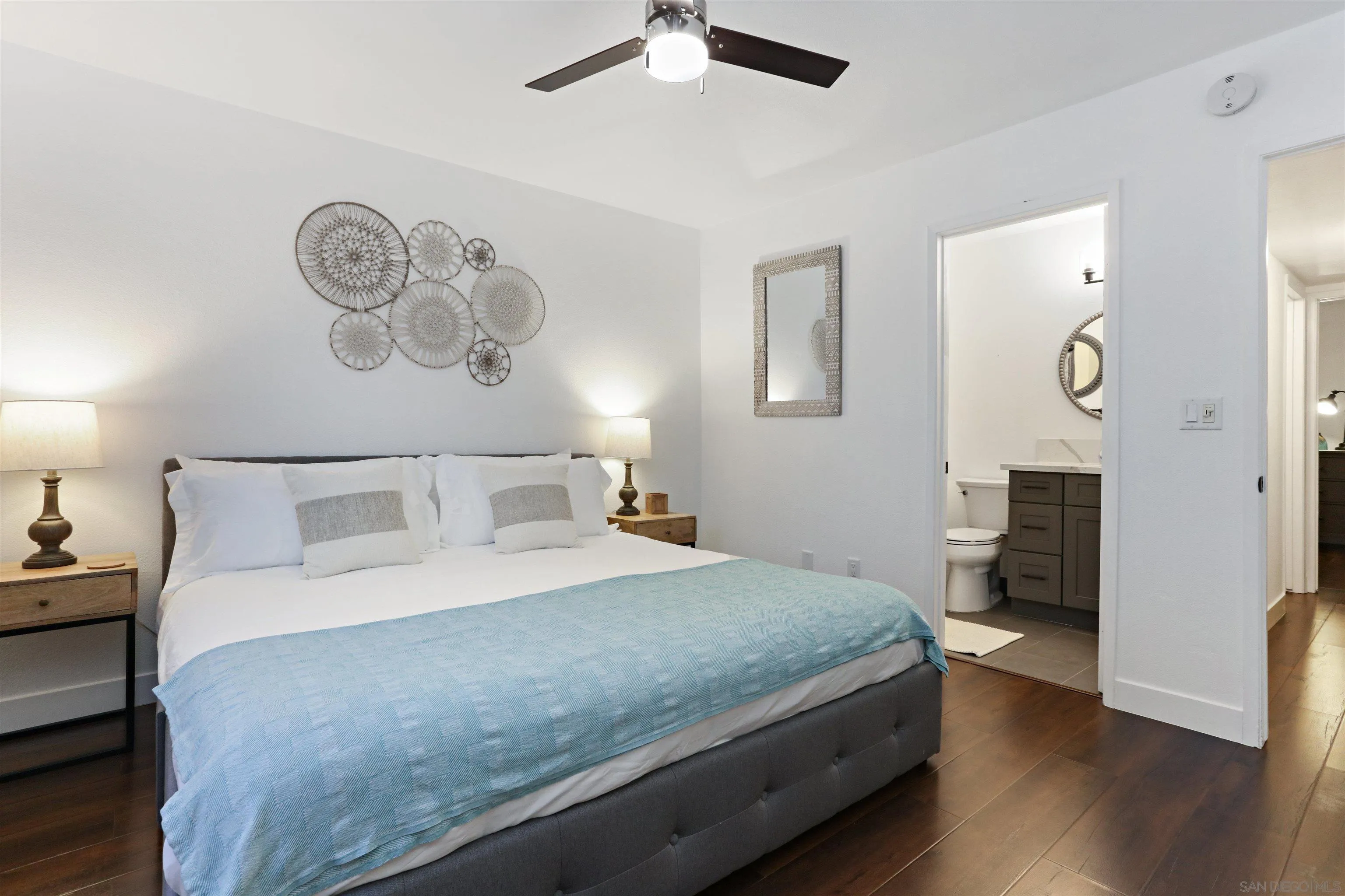 14607 Bowdoin Road Poway, CA 92064 - Photo 17 of 30 a bedroom with a large bed and a chandelier