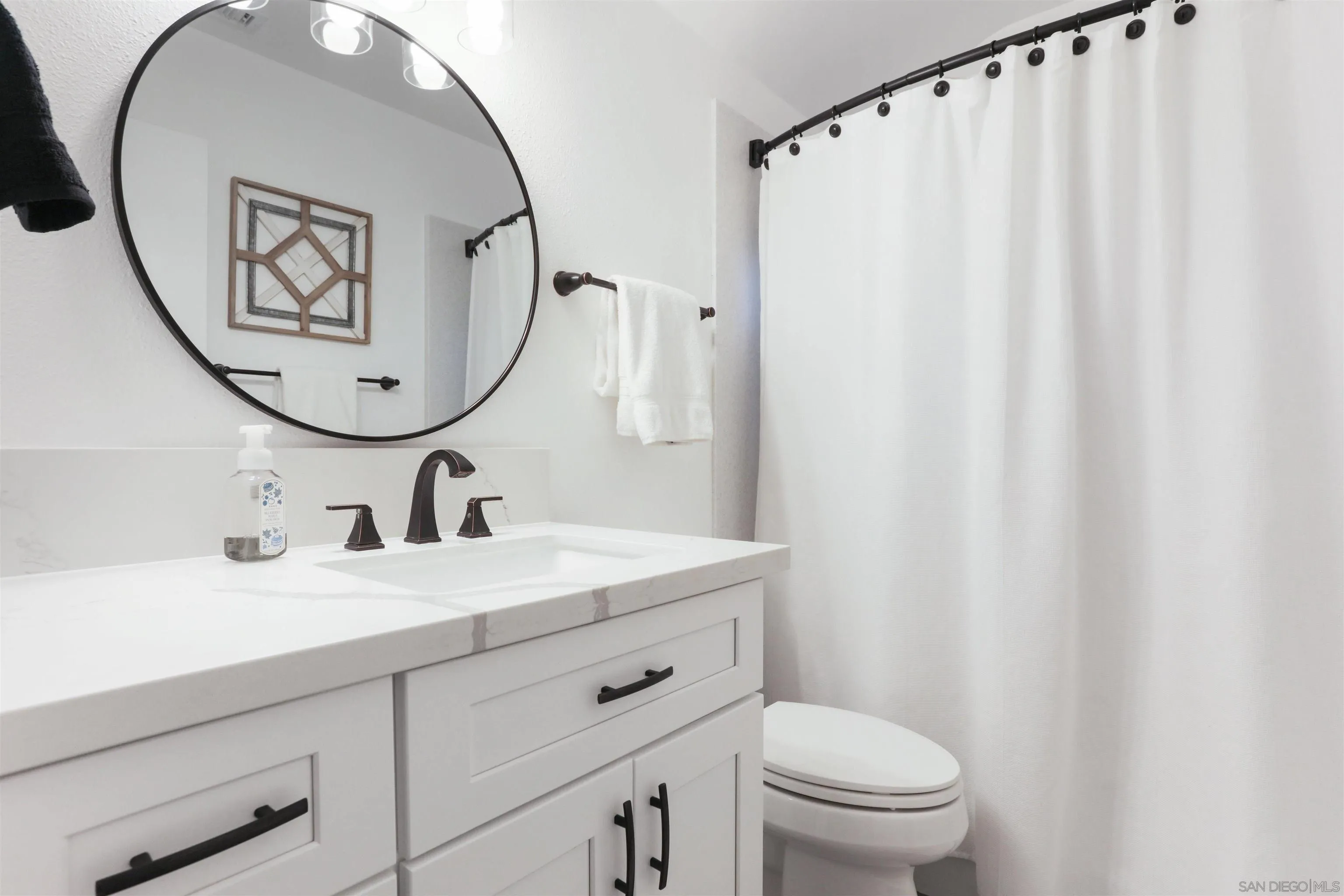 14607 Bowdoin Road Poway, CA 92064 - Photo 21 of 30 a bathroom with a sink vanity mirror and toilet