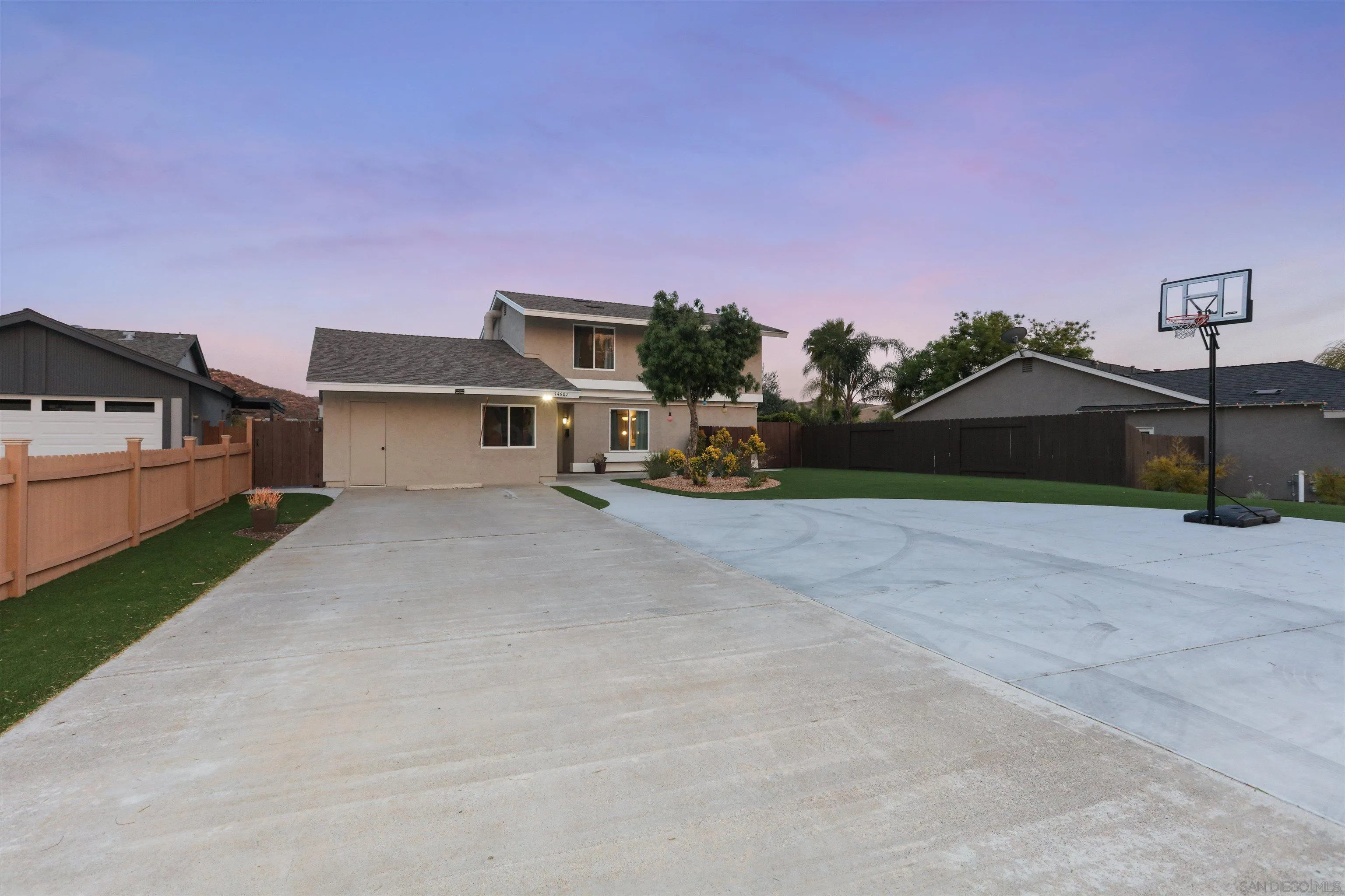 14607 Bowdoin Road Poway, CA 92064 - Photo 22 of 30 a front view of a house with a yard and garage
