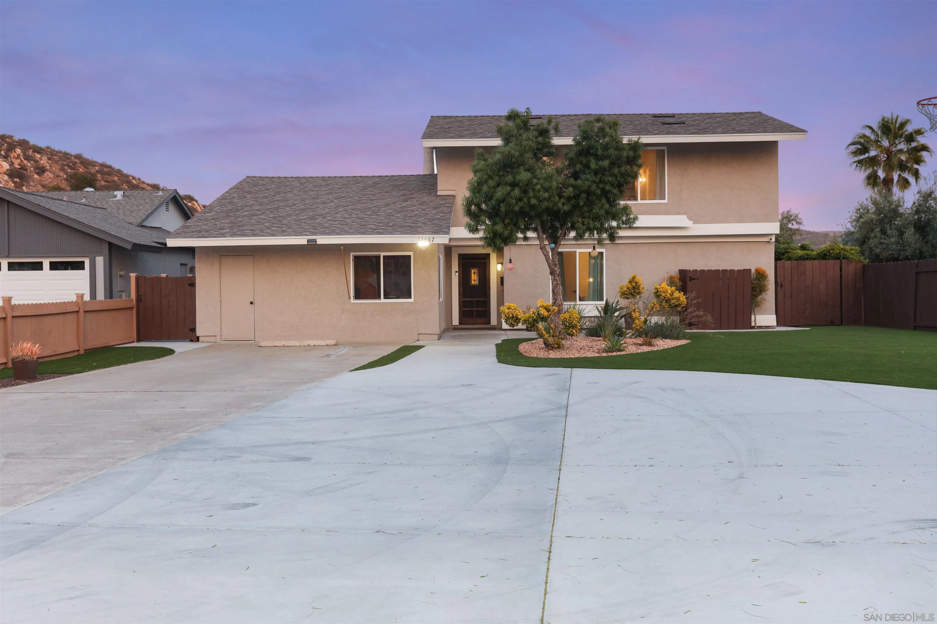 14607 Bowdoin Road Poway, CA 92064 - Photo 23 of 30 a front view of a house with a yard and garage