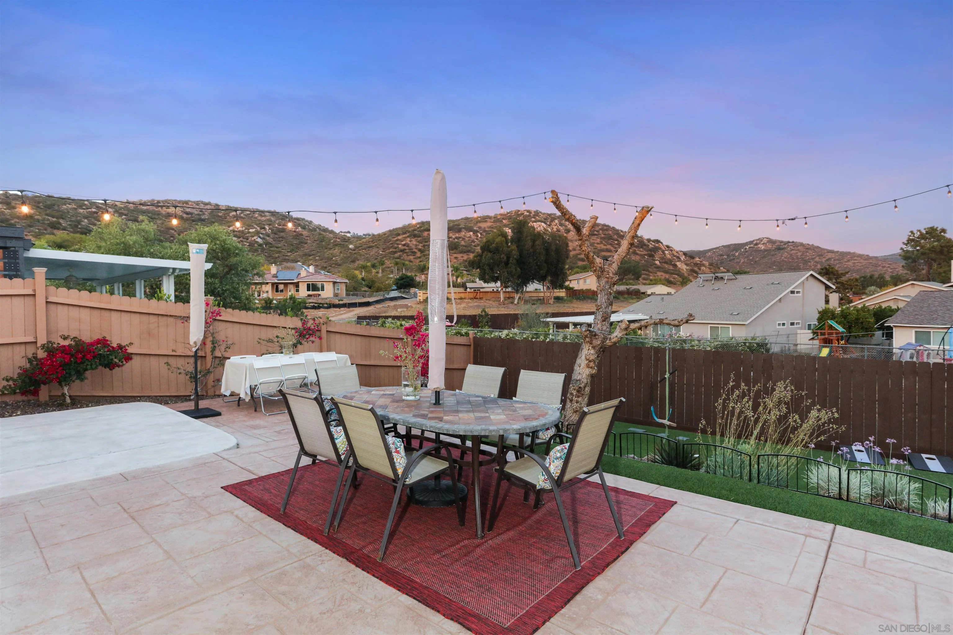 14607 Bowdoin Road Poway, CA 92064 - Photo 25 of 30 a view of a terrace with a table and chairs