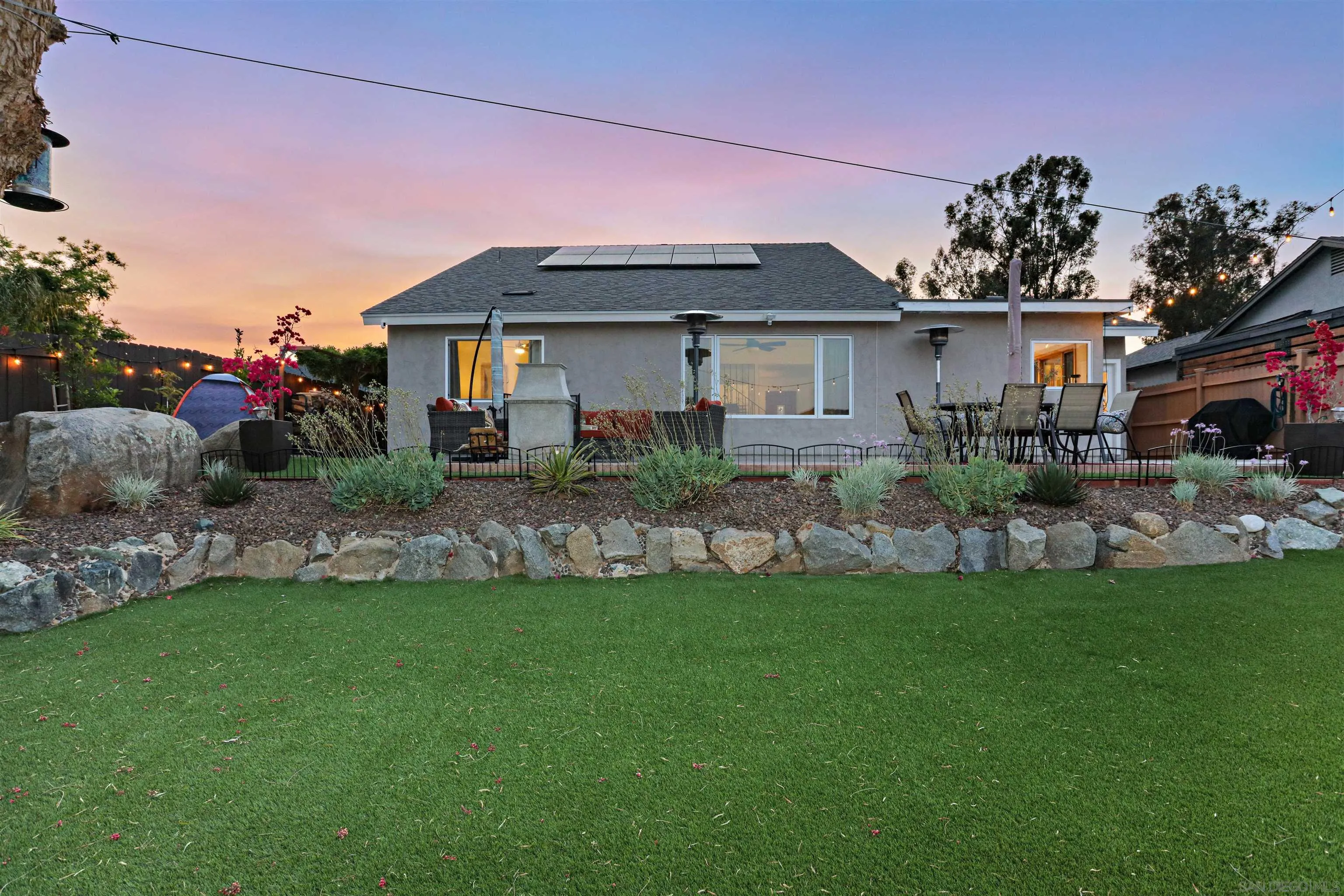 14607 Bowdoin Road Poway, CA 92064 - Photo 30 of 30 a front view of a house with a yard and potted plants