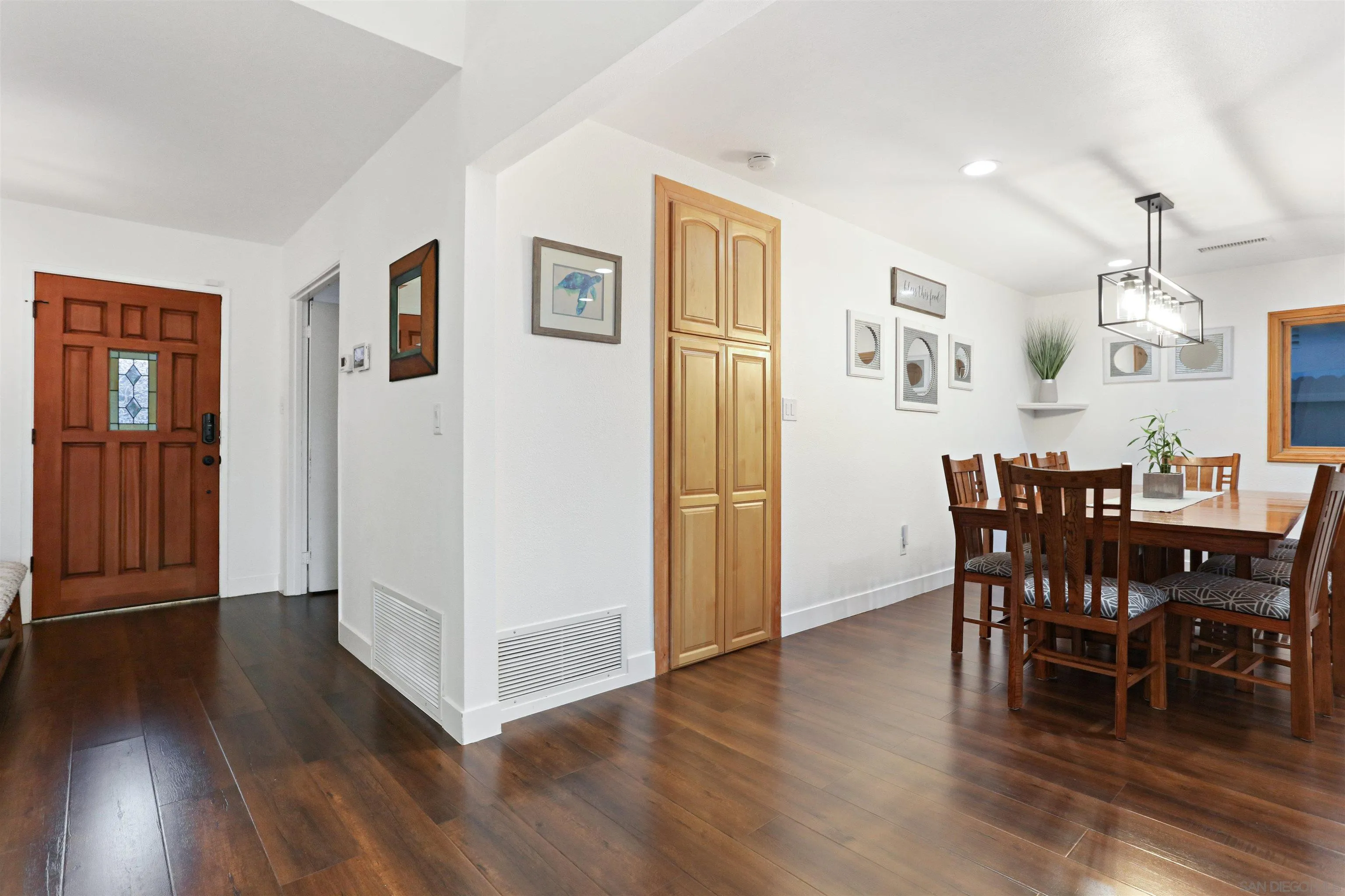 14607 Bowdoin Road Poway, CA 92064 - Photo 5 of 30 a view of a dining room with furniture and wooden floor