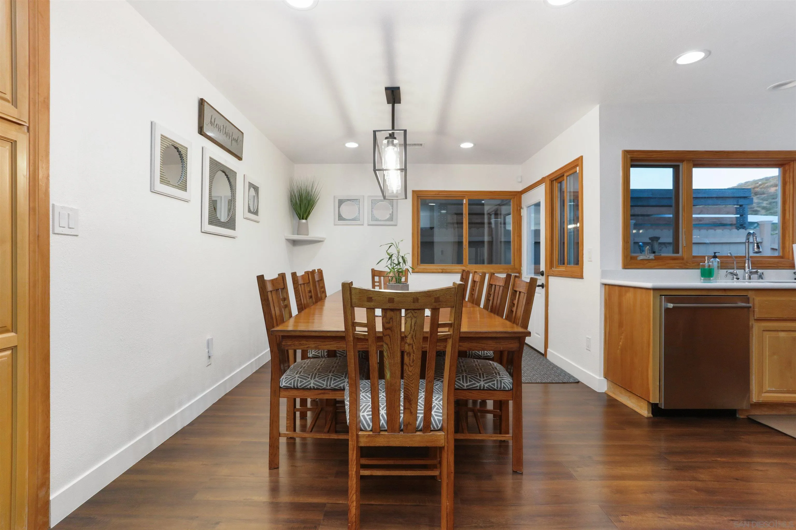 14607 Bowdoin Road Poway, CA 92064 - Photo 6 of 30 a view of a dining room with furniture and wooden floor