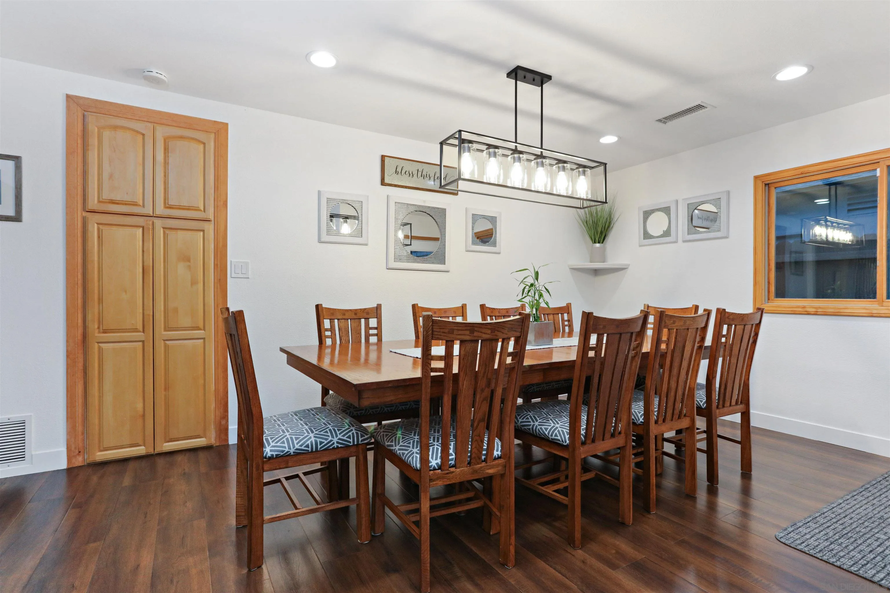 14607 Bowdoin Road Poway, CA 92064 - Photo 9 of 30 a view of a dining room with furniture wooden floor and chandelier