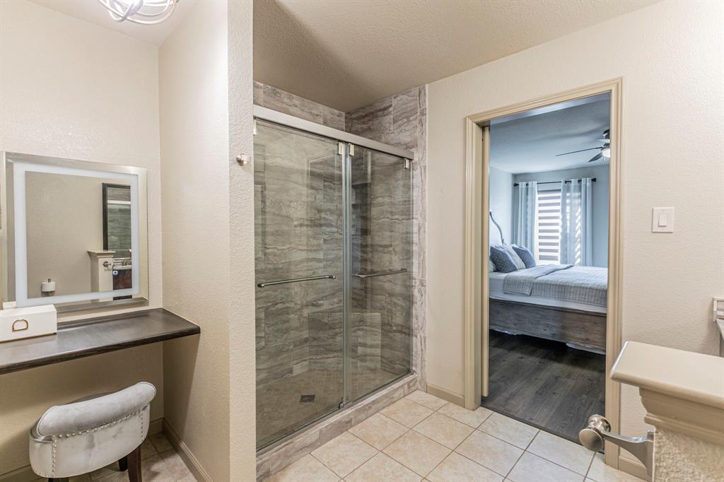 2210 Torch Lake Drive Forney, TX 75126 - Photo 14 of 29 a bathroom with a sink and a mirror