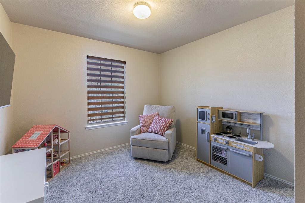 2210 Torch Lake Drive Forney, TX 75126 - Photo 18 of 29 a living room with furniture and a window