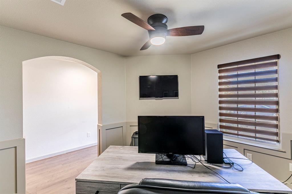 2210 Torch Lake Drive Forney, TX 75126 - Photo 20 of 29 a living room with a flat screen tv and a fireplace