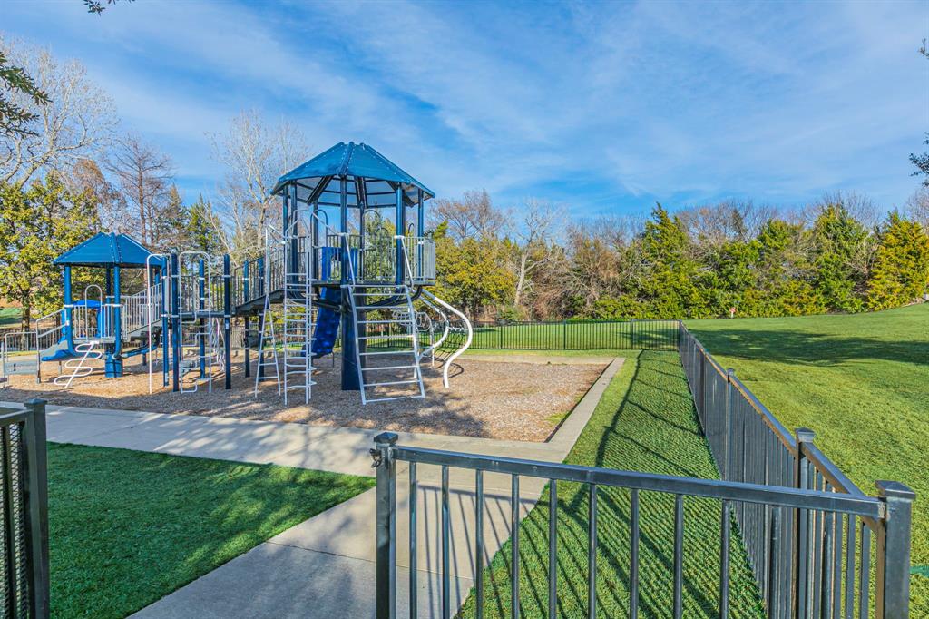 2210 Torch Lake Drive Forney, TX 75126 - Photo 29 of 29 a view of a house with a yard and furniture