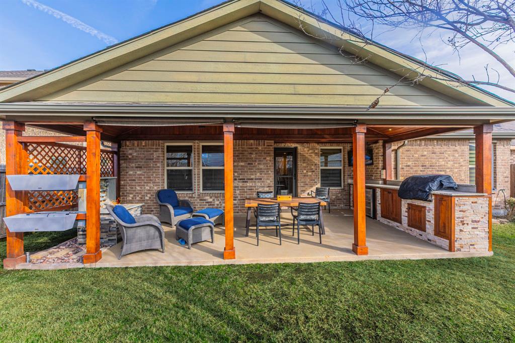 2210 Torch Lake Drive Forney, TX 75126 - Photo 3 of 29 a front view of a house with patio and garden
