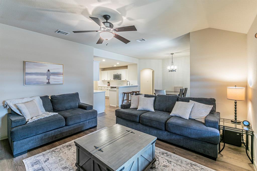 2210 Torch Lake Drive Forney, TX 75126 - Photo 5 of 29 a living room with furniture and a wooden floor