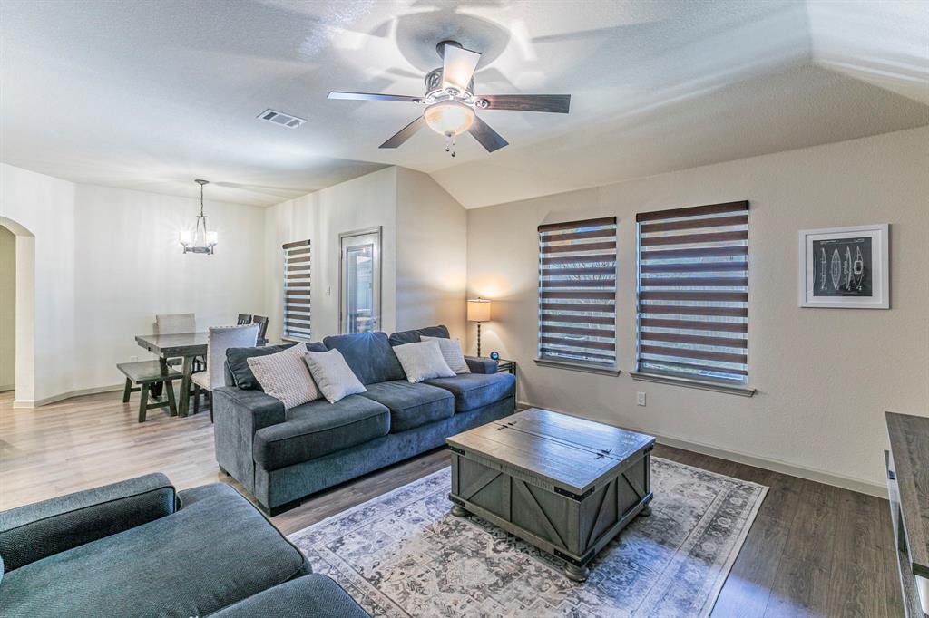 2210 Torch Lake Drive Forney, TX 75126 - Photo 6 of 29 a living room with furniture and a large window
